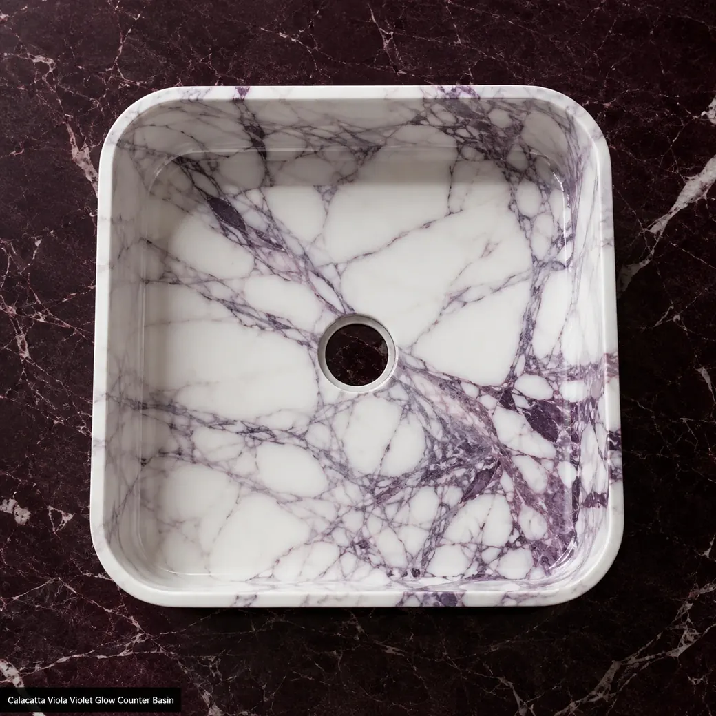Top-down polished Calacatta Viola countertop basin with luminous white stone and violet veining