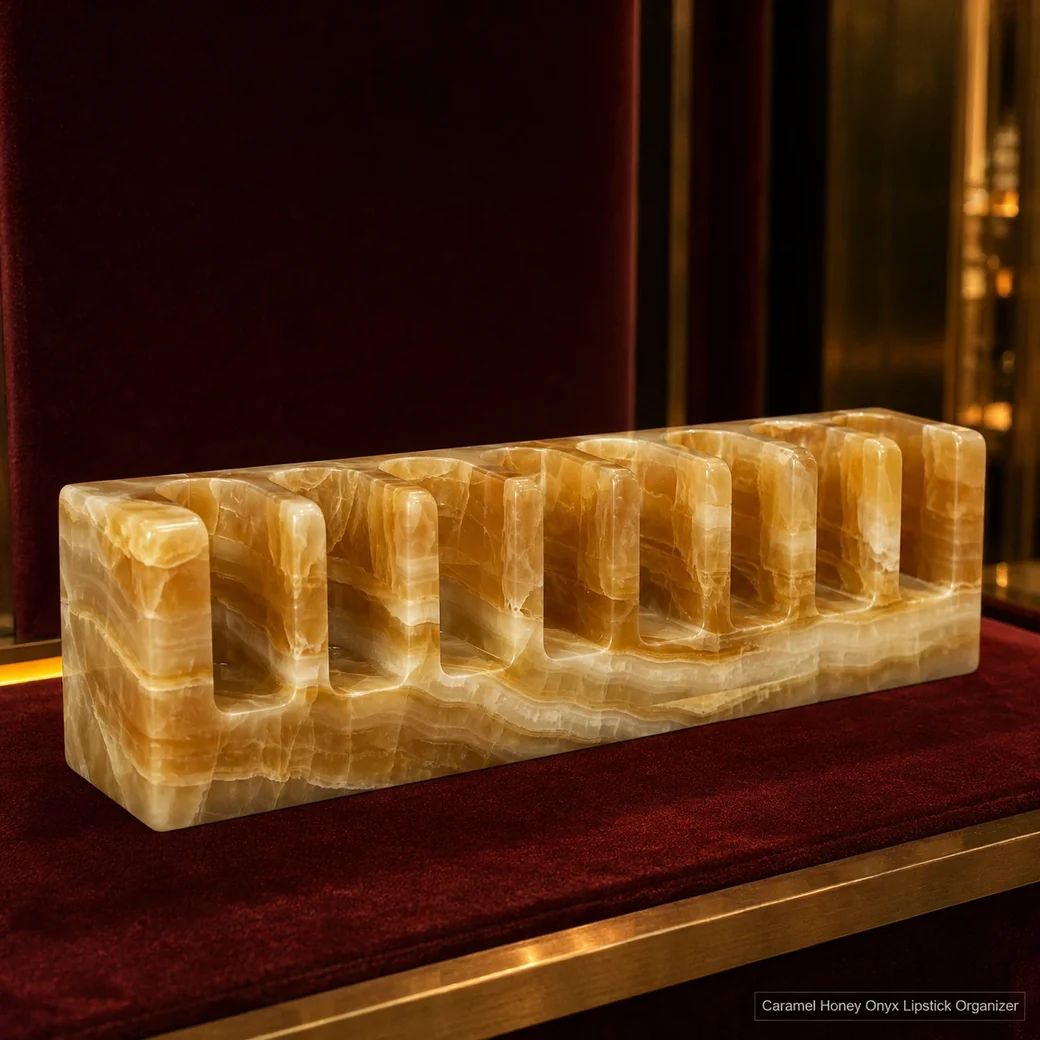 Caramel honey onyx lipstick organizer on burgundy velvet, low side view showing empty wells and glowing translucency.