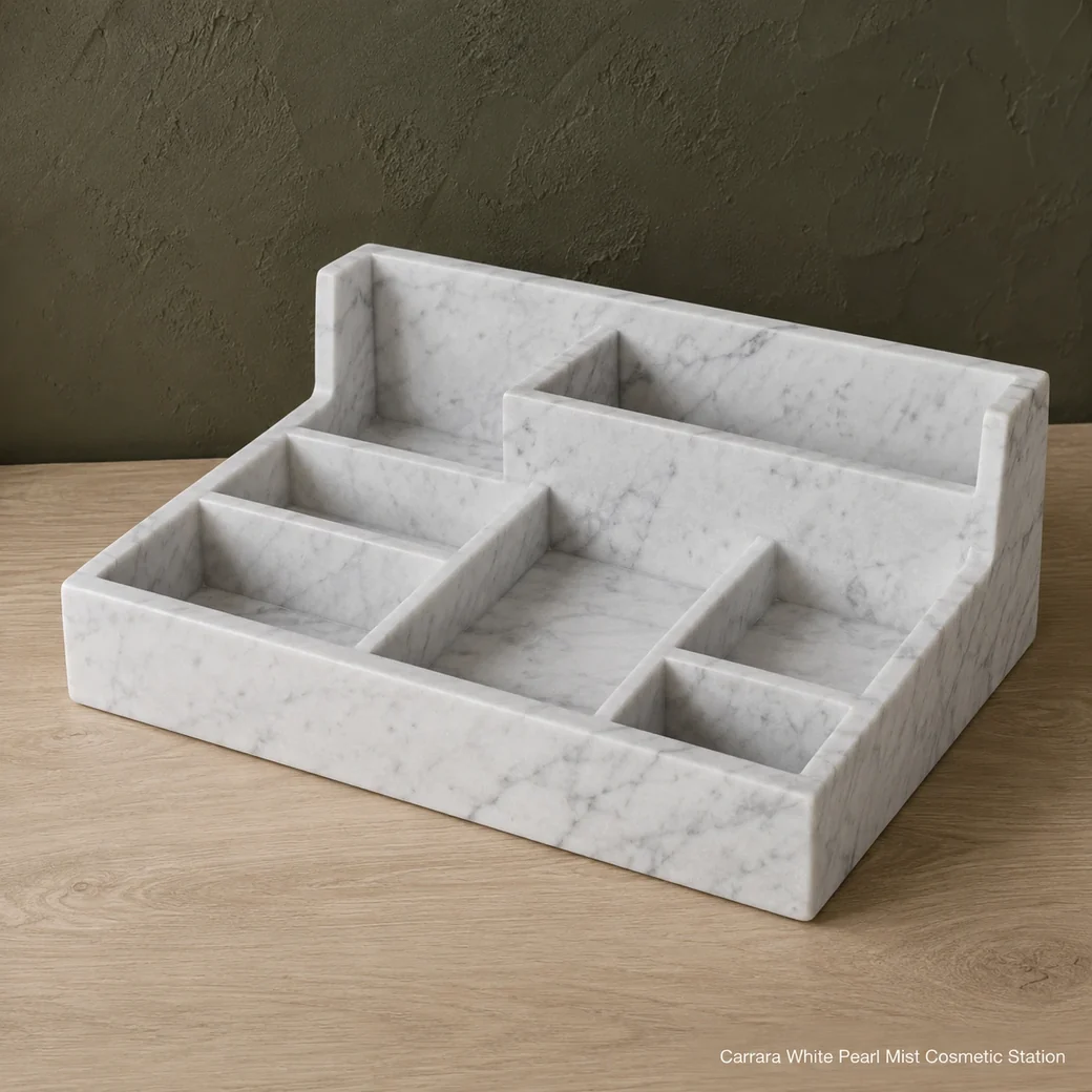High rear view of Carrara makeup organizer on pale oak, showing varied compartment heights and fine grey vein continuity.