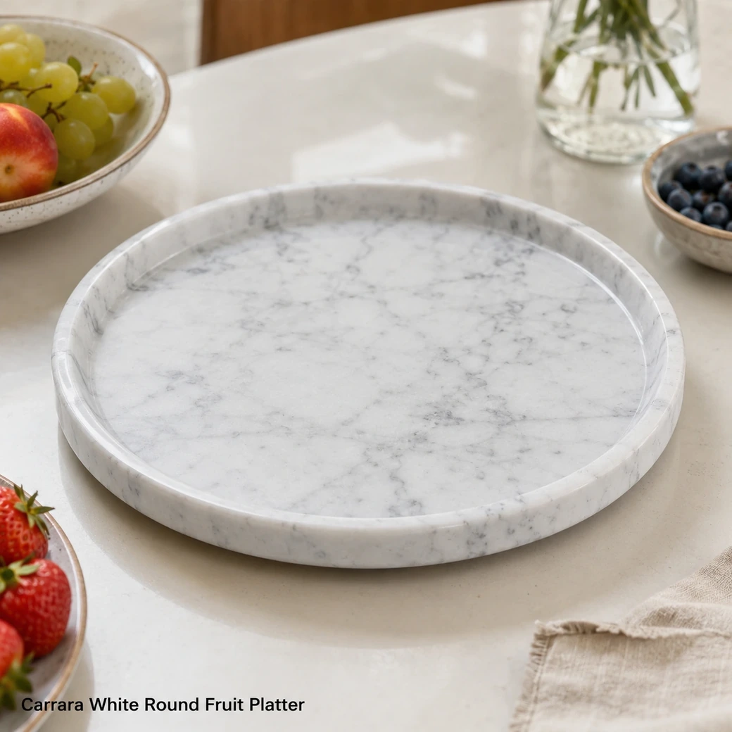 Carrara White round fruit platter with cool white marble, fine grey veining and low-gloss polish.