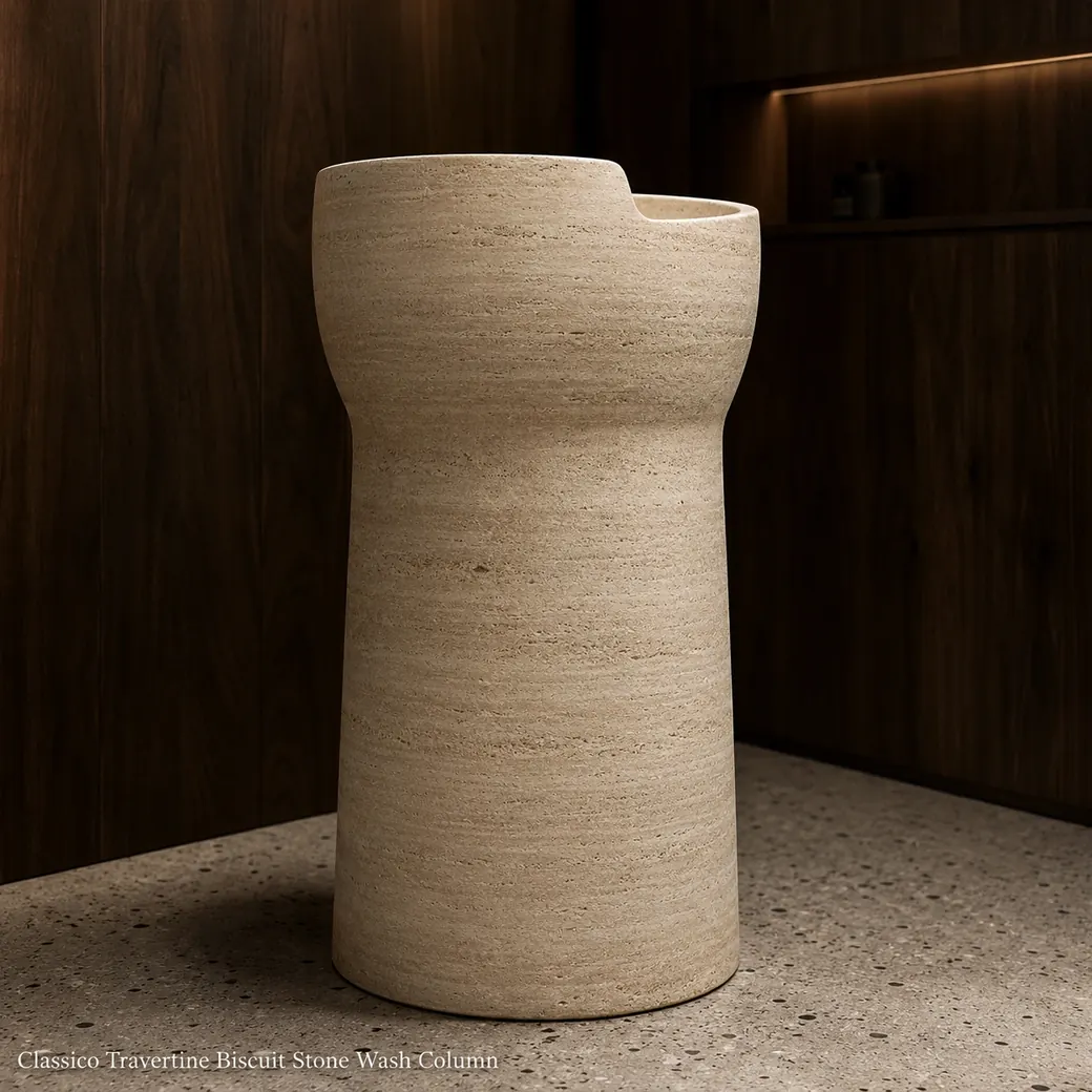 Rear three-quarter biscuit beige travertine monolithic basin with brushed texture and tapered base