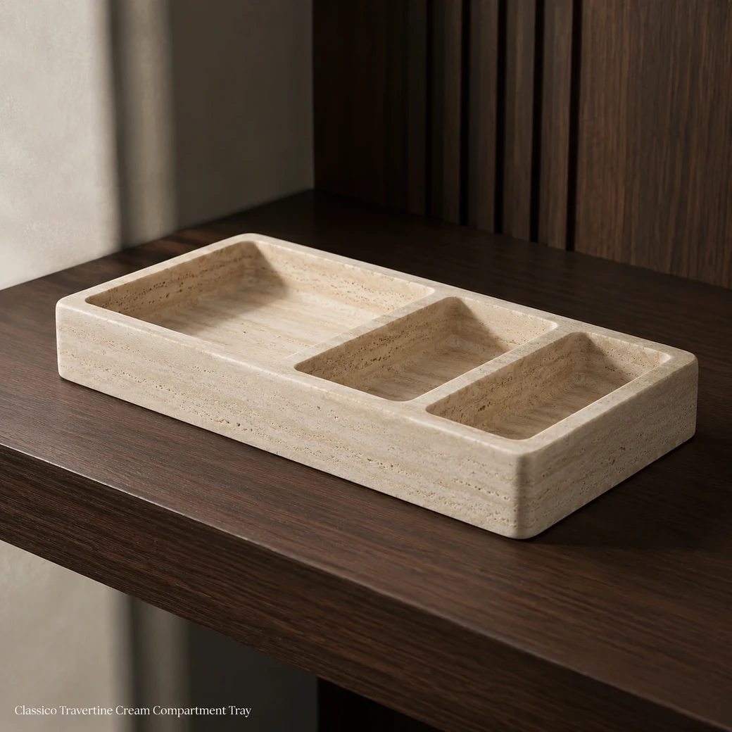 Cream travertine compartment tray on dark walnut shelf, low rear view showing divided sections and honed texture.
