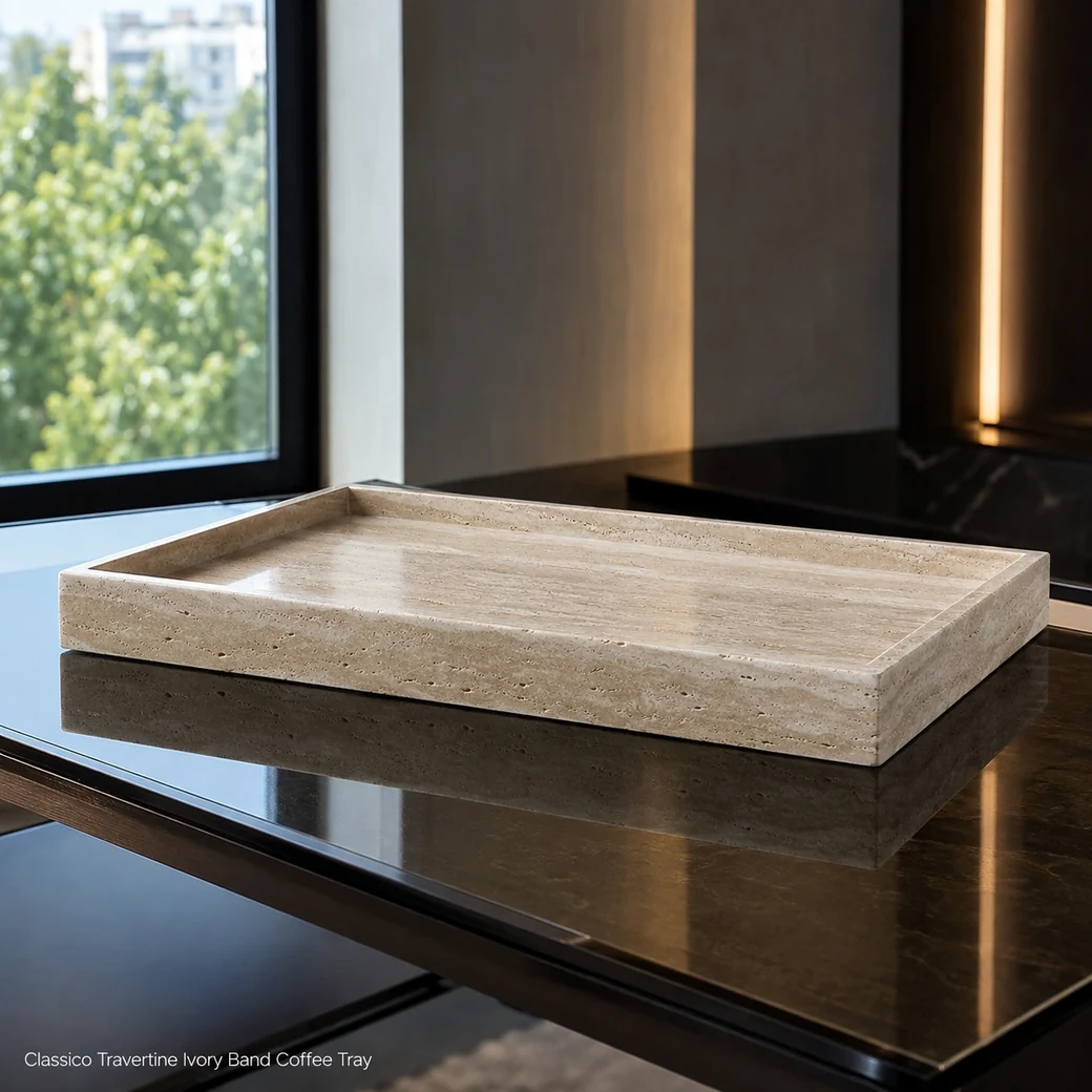 Ivory-banded travertine coffee tray on smoked glass, low side view showing filled pores and polished profile.