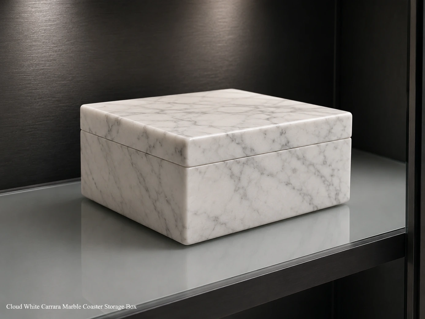Closed Carrara marble coaster box on smoked glass, showing cloud-white polish and continuous soft grey veining.