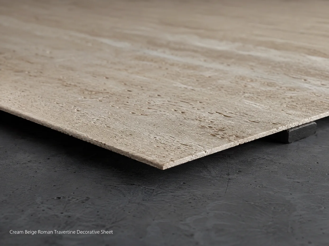 Cream-beige Roman travertine sheet on an inspection bench, macro edge view showing its ultra-thin 2 mm profile