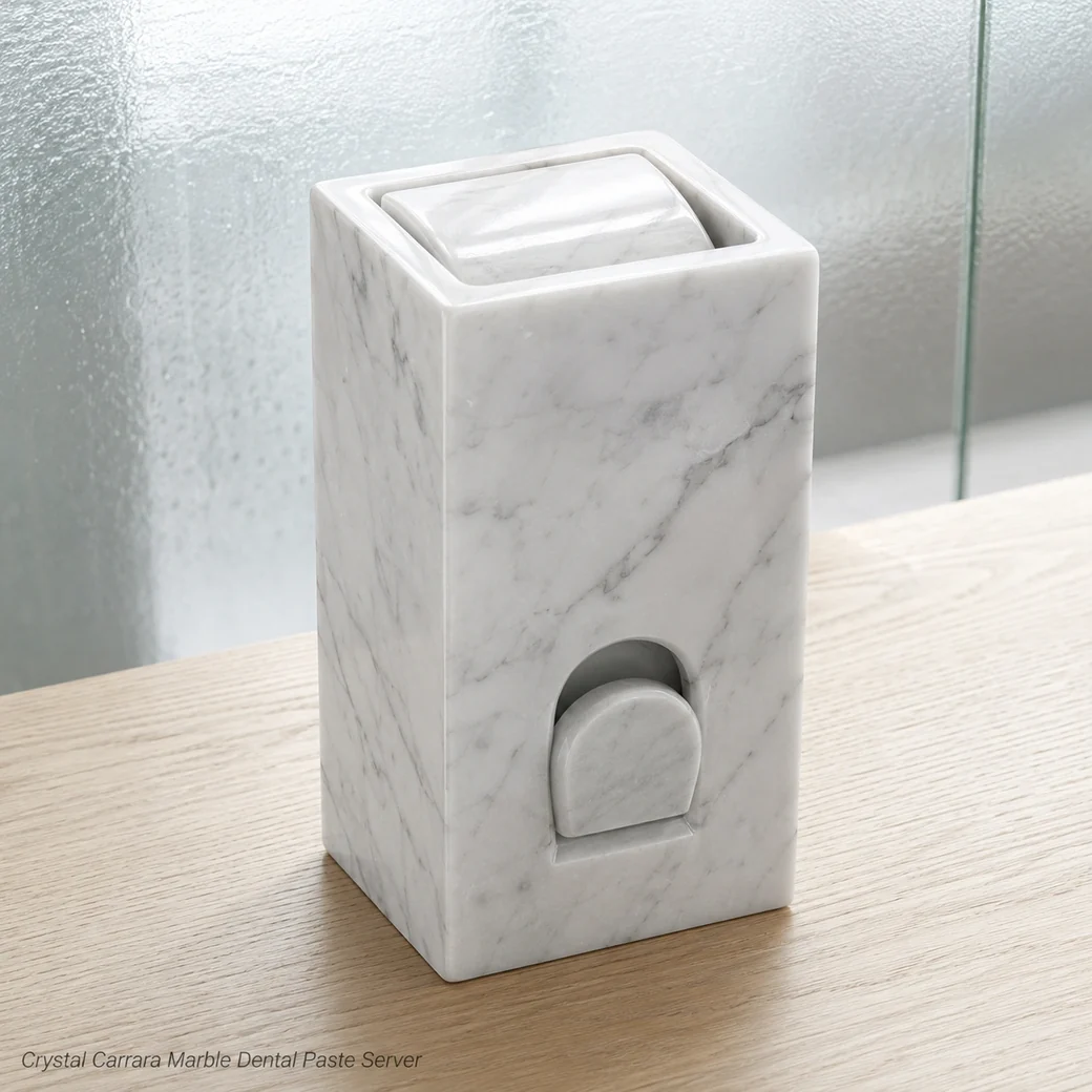 Crystal Carrara toothpaste dispenser on pale oak, high front view showing polished casing and loading geometry.