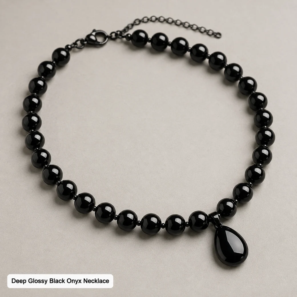 Deep glossy black onyx necklace with polished stone beads