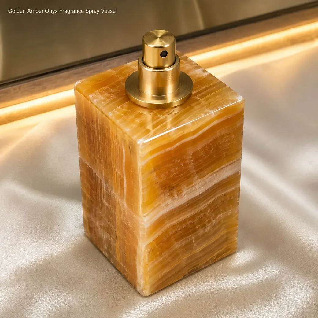 Amber honey onyx perfume atomizer on champagne satin, top-front macro view revealing brass pump and glowing bands.
