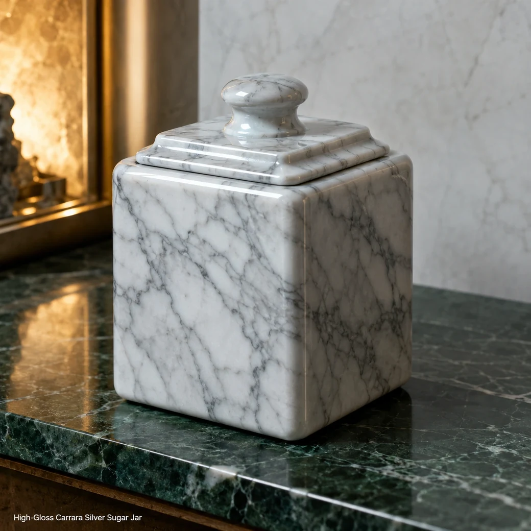 Silver white Carrara sugar jar on deep green shelf, low front view emphasizing polished corners and closed lid.