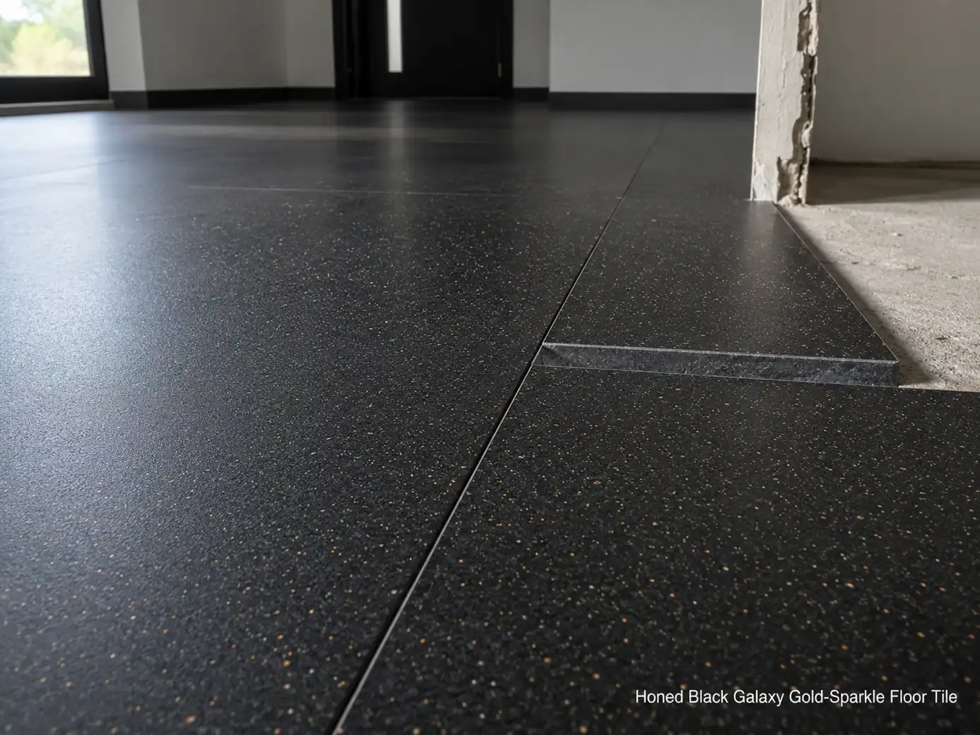 Black Galaxy granite floor installed in an entry hall and photographed along the tile joints