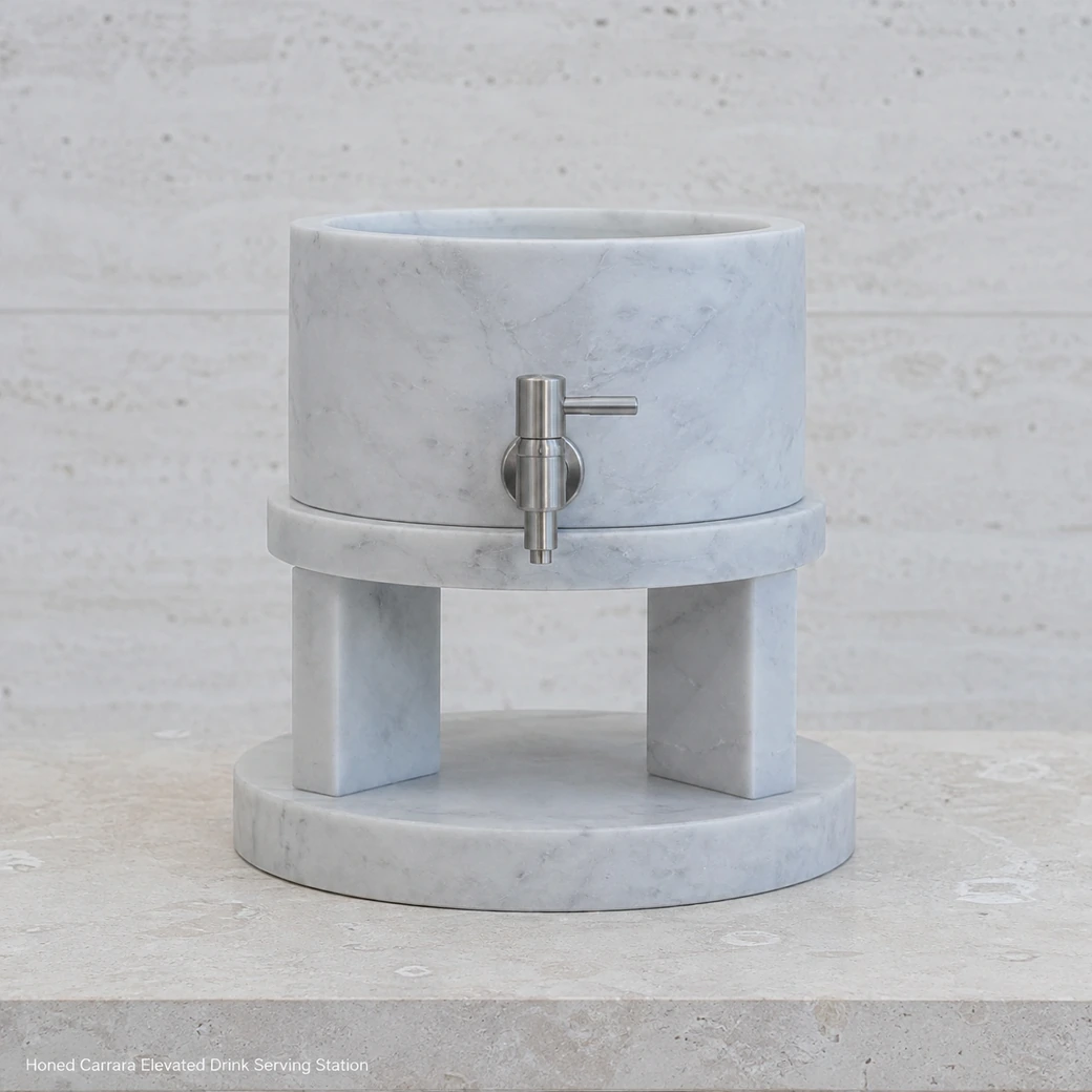 Pale Carrara beverage server with stone stand, low front view showing elevated vessel, tap clearance and solid base.