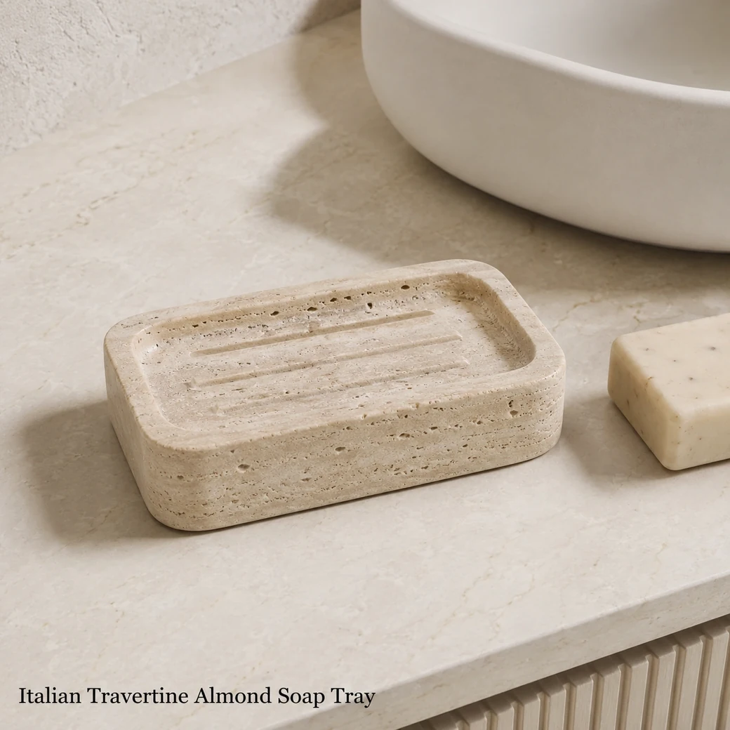 Italian Travertine soap tray in soft almond beige with subtle banding, satin finish and drainage grooves.