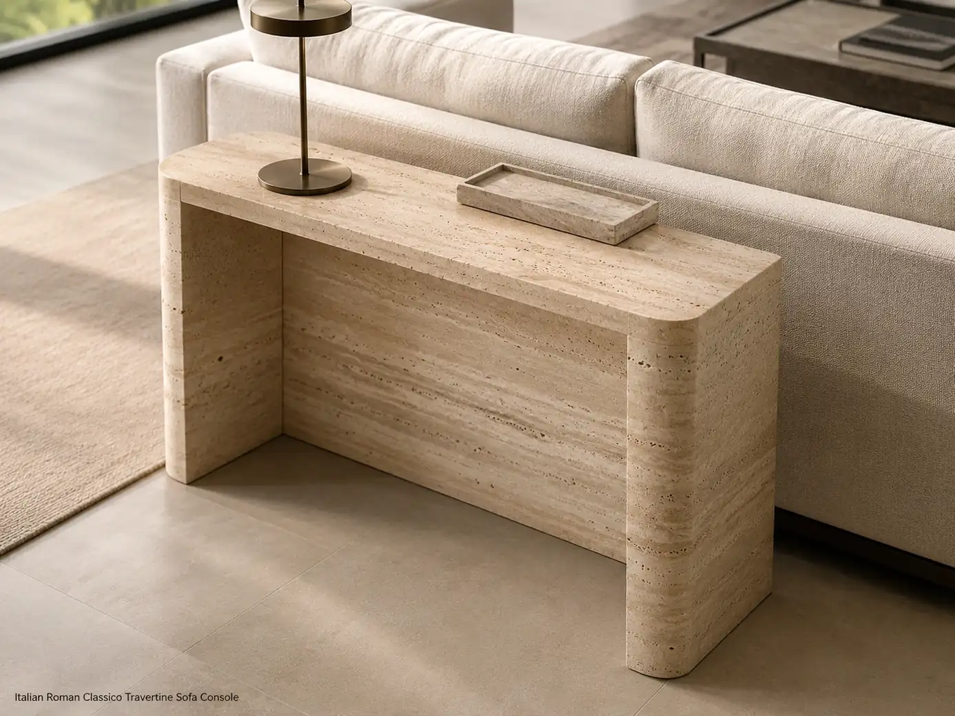 Brushed Italian travertine sofa table behind a modern sofa with ivory-beige pores and linear stone movement