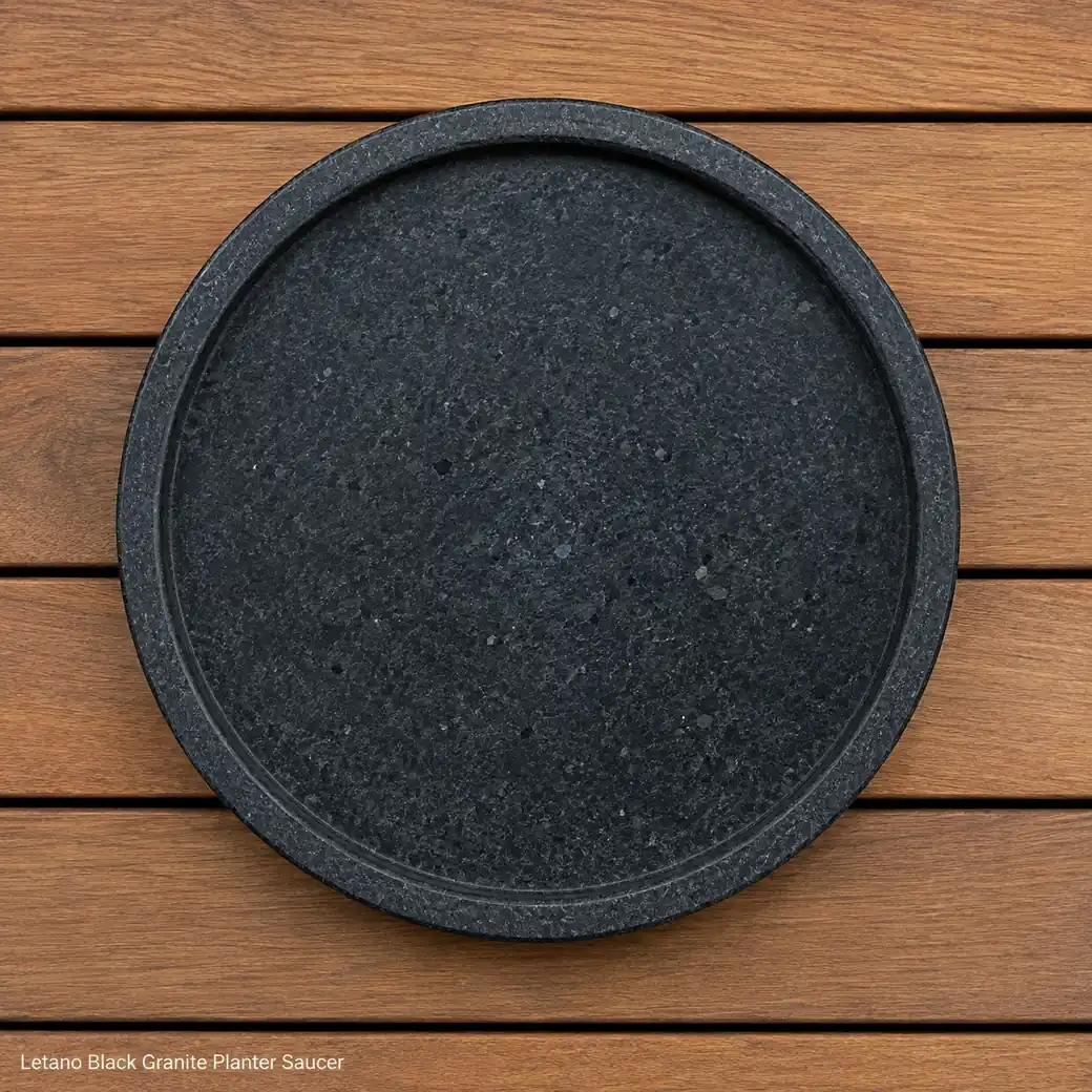 Overhead Black Granite plant saucer on teak decking with charcoal leathered grain and raised rim.