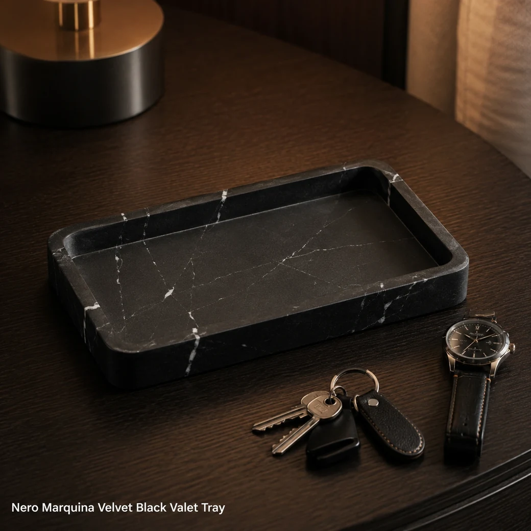 Nero Marquina valet tray in velvet black limestone with fine white veins and leather-touch texture.