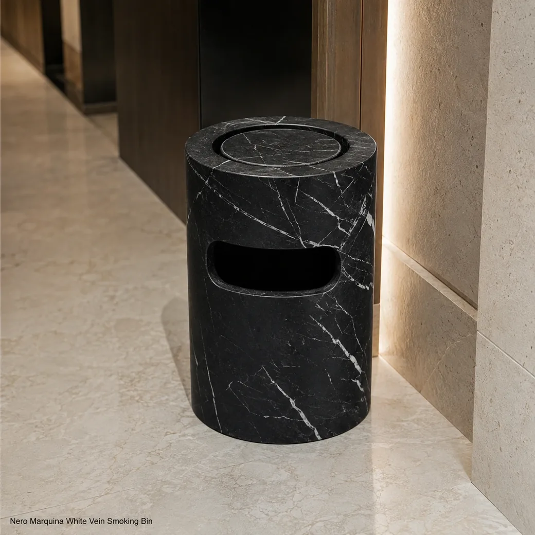 Nero Marquina smoking bin on pale limestone floor, rear-right view showing bright veining and matte black texture.
