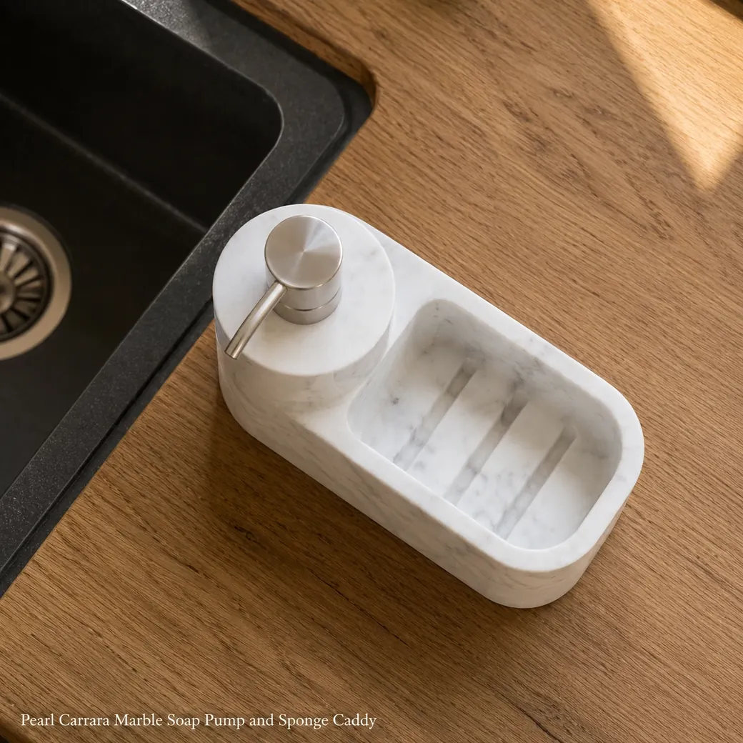 Pearl Carrara soap pump and sponge caddy on oak, top-down view showing pump opening and drainage grooves