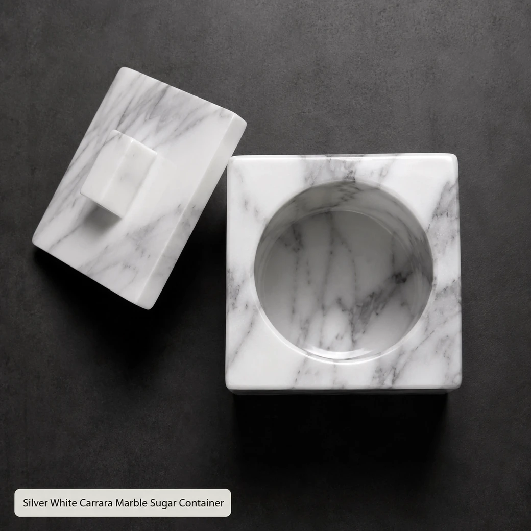 Silver white Carrara sugar container on charcoal, overhead view with polished lid set beside the empty jar