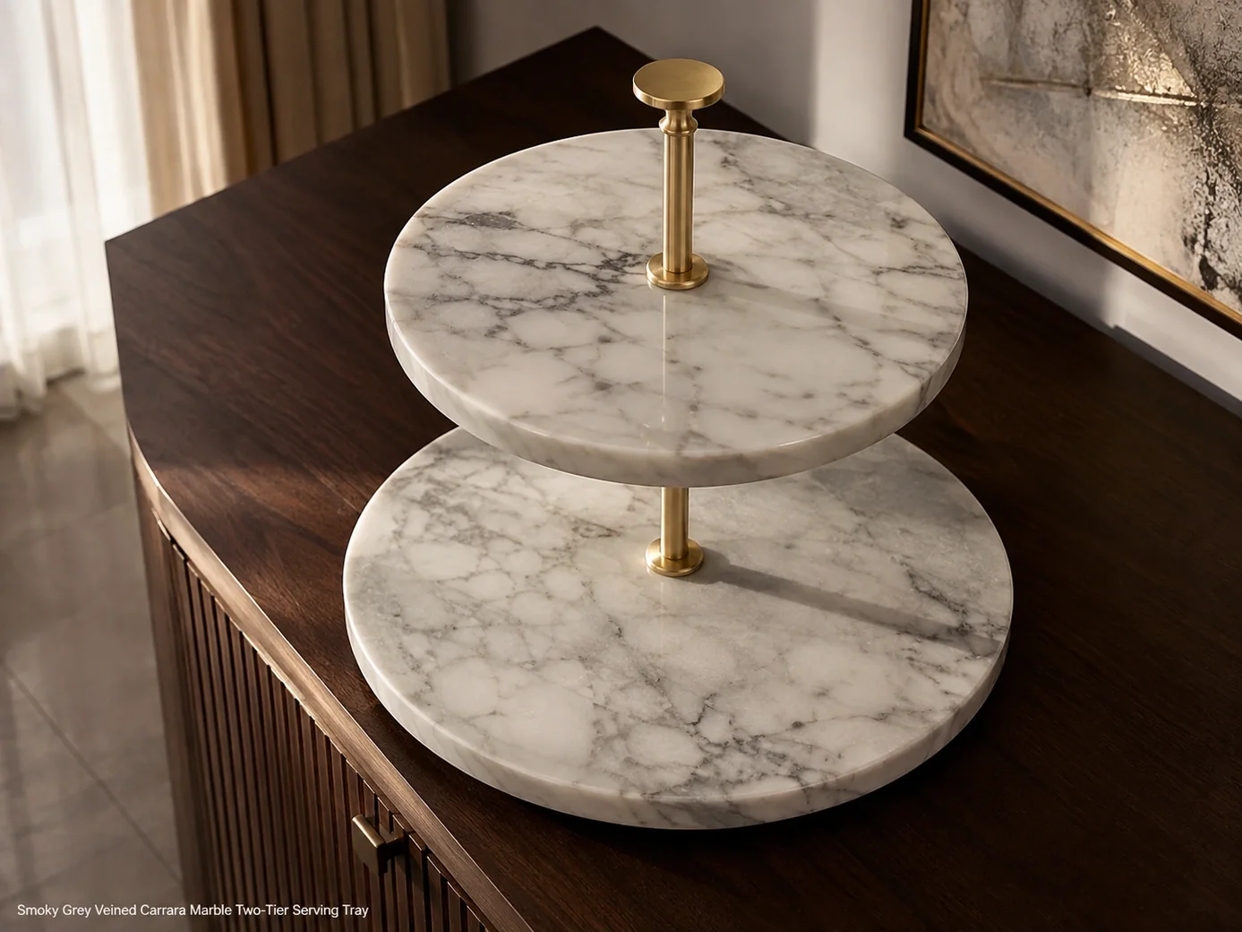 High-angle Carrara marble two-tier tray on dark walnut, showing smoky grey veins, polished tiers and brass center rod.