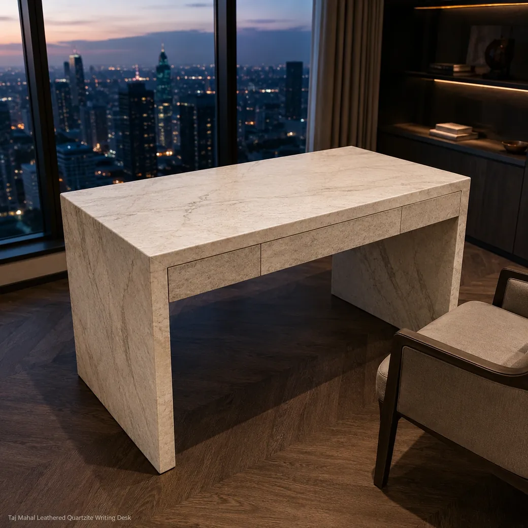 Rear-view Taj Mahal writing desk facing a city window at dusk with its full leathered quartzite top visible.