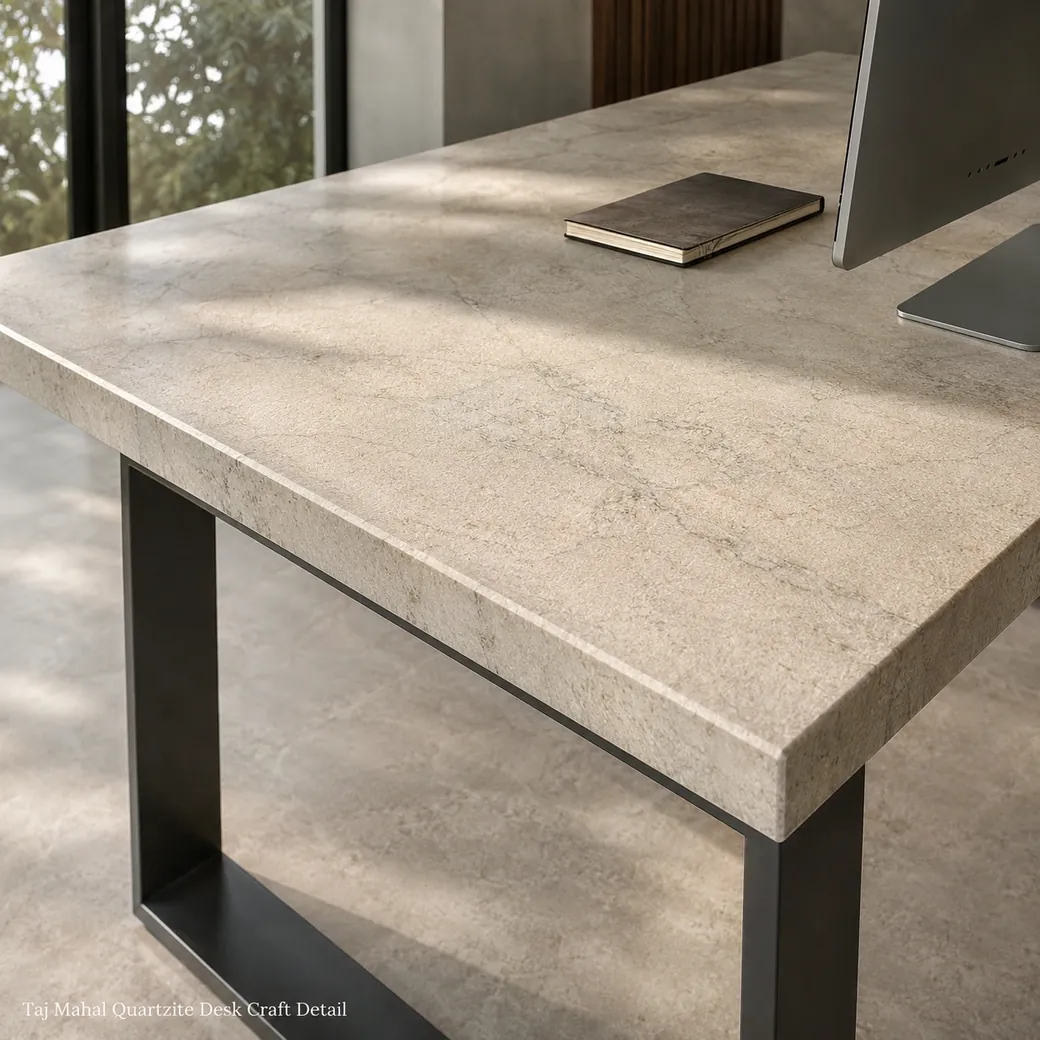 Satin-leathered Taj Mahal quartzite desk showing champagne-cream stone and subtle grey veining