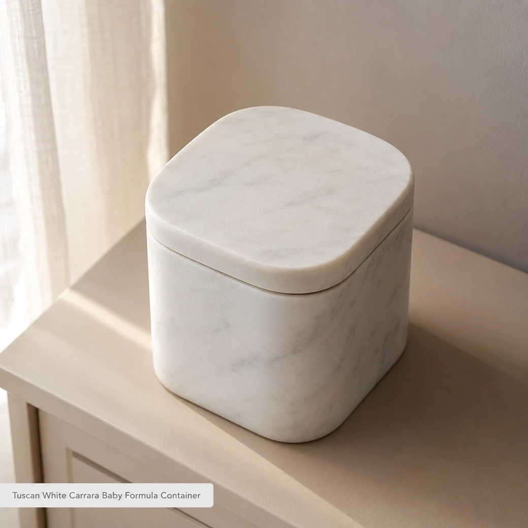 Tuscan white Carrara baby formula container on a beige dresser, top-angle view with snug matte stone lid