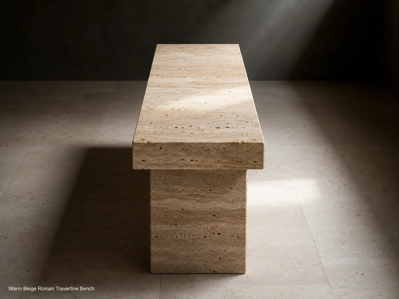 Roman travertine bench seen from a high end angle in a dark gallery with limestone flooring